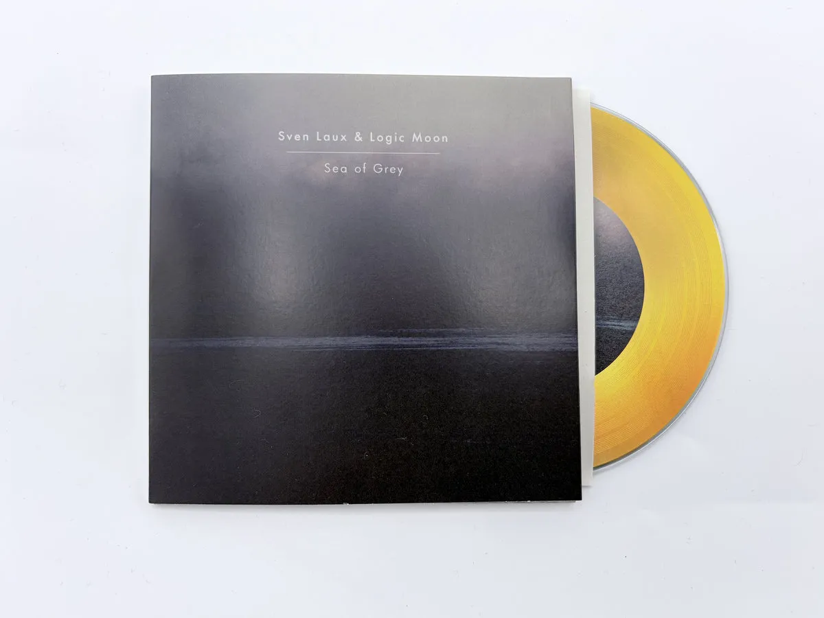 Sea of Grey sleeve with the gold disc
